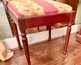 Victorian-style upholstered wooden stool with a floral tapestry seat