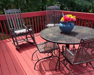 Wrought iron table and 4 chairs, 2 wooden rocking chairs