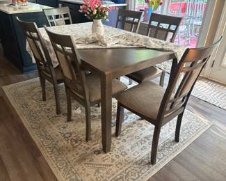Kitchen table with 6 chairs, rug