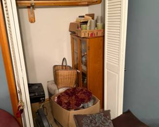 Decorative Pillows, Books and Boxes of Clothes