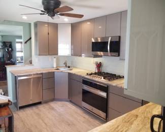 Kitchen is U-shaped with additional cabinets in laundry room