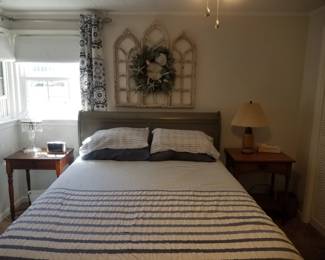 Queen bed; wall decor; end tables; table lamps