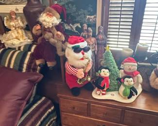 Animated Musical Christmas Figurines Santa playing Saxophone, Snowman, and Penguins