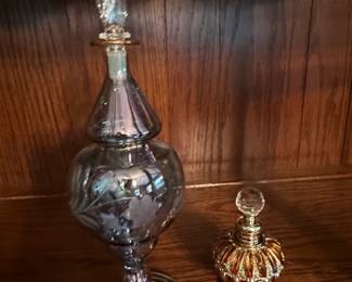 Vintage Egyptian Style Perfume Bottles with Etched Floral Design and Ornate Metal Base