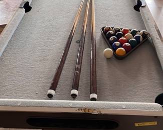 This is a compact pool table, not full size.