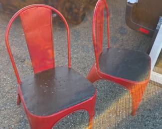 Pair of custom made steel mid century chairs.