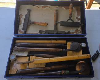 Collection of antique book binding tools.