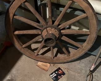 Antique wagon wheel with iron band wrapped around. 