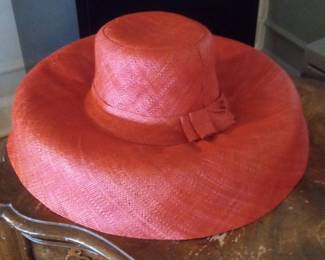 Red Wide-Brimmed Straw Hat with Bow Accent