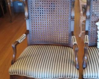 Ornate Louis XV Style Walnut Armchair with Cane Back and Striped Upholstery
