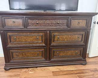 Haverty’s Grand Estates 7-Drawer Dresser – Burl Wood & Lion Hardware Description: Elevate your bedroom with this stately, traditional dresser from Haverty's Furniture. This piece is part of a premium collection known for its "Old World" craftsmanship and robust silhouette. Key Features: •	Design: Rich dark cherry/walnut finish with beautiful burl wood veneer inlays on the drawer fronts. •	Details: Stunning center drawer with deep-relief scroll carvings and antique brass-finished lion-head ring pulls. •	Storage: 7 spacious drawers including three top drawers (perfect for jewelry/accessories) and four large lower drawers for clothing. •	Construction: Solid wood and veneer construction with classic bun feet and a beveled top edge. •	Condition: Gently used pre-owned condition. Dimensions: 68"W x 20"D x 38"H. Price: $450 OBO  Must be able to haul; this is a heavy, high-quality solid wood piece.