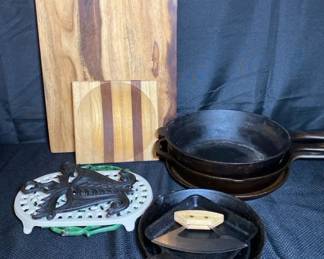 Cast Iron Skillets. Trivets And Wood Cutting Board