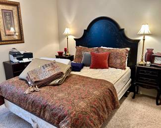 Love this black gold leafed headboard and nightstands
