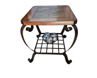 wrought iron table with slate top. one of a pair