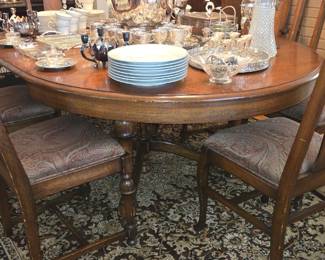 Antique dining table and seven chairs