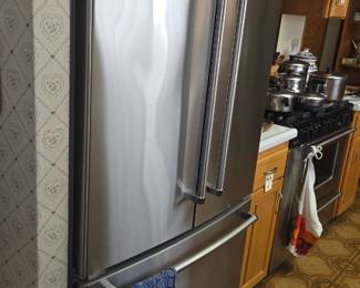 KitchenAid French door refrigerator with bottom freezer.