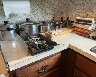 Pots and pans, cookbooks, utensils, knives