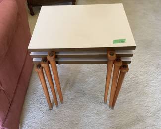 Nesting tables with easy to clean tops