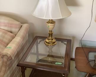 Rectangular end table with glass top and lower shelf