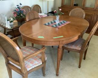 In excellent condition, this dining set measures 66”l x 44” w x 29” h.  Includes 2 leaves measuring 20” wide.  Has table pads and six chairs.