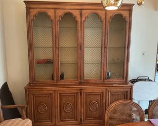 China cabinet with glass shelves and lights