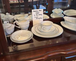 12 place setting. Harmony House "Mary" plus service pieces. Only one dinner plate has one small chip. We believe this set has never been used.
