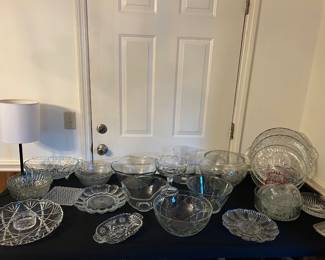 Many nice cut glass bowls and plates.