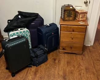 Luggage. Small tables and cabinets.