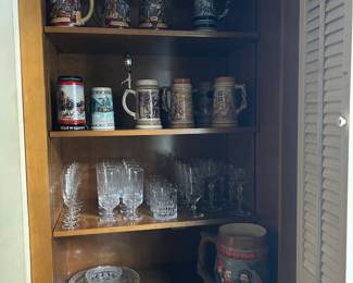 Steins and crystal drinkware. Look at that very large one!