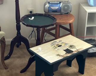 Small tables. Many radios and tape players. Stools.