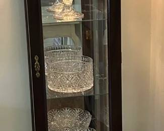 Lighted Curio. Filled with Shannon Crystal Footed compotes.