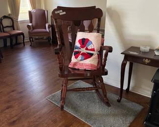 Large heavy rocking chair. And a gorgeous quilt!