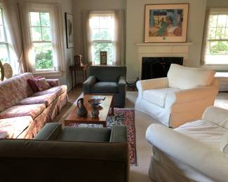 Living room furnishings include a pair of Mitchell Gold sage green chairs & 2 Restoration Hardware swivel slip canvas covered easy chairs ( for easy washing) etc. 