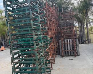 (22) 11 inch green wine barrel/steel drum racks and (120) 14-inch orange wine barrel/steel drum racks - $25 each.