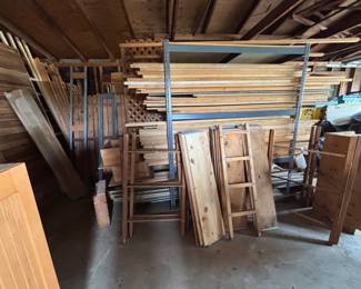 Pile of miscellaneous lumber and wood items. This is a take all situation for $175. Metal shelving shown is $15 each.