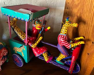 Bicycle-Taxi with Giraffe Driver and Passengers by Martín Melchor