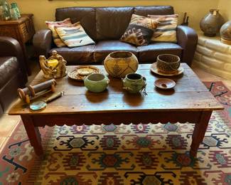 Native American baskets, leather couch, coffee table, southwestern rug
