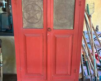 Punched tin red cabinet