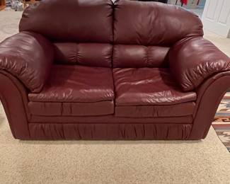 f Red Leather Loveseat with Plush Cushions and Classic Silhouette