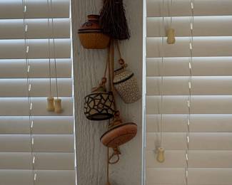 Assorted Mexican Folk Art Ceramic Wall Hangings and Iridescent Glass Orb