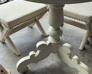 Round Pedestal Dining Table with Upholstered X-Base Stools