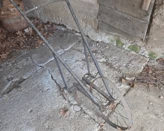 Antique cultivating push behind