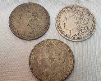 Three 1884 Morgan Silver Dollars, One With An O