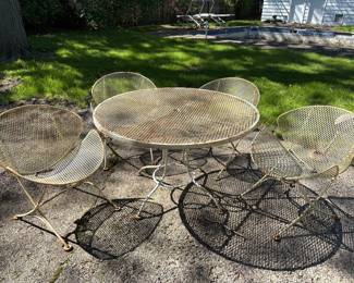 1950s Maurizio Tempestini for Salterini clamshell patio set: table with 4 chairs, 4 benches, and 2 occasional tables. They all need some restoration, but these are amazing and rare pieces. AVAILABLE FOR IMMEDIATE PURCHASE.