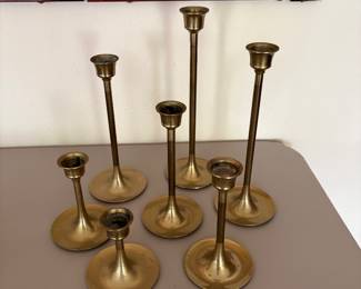 set of 7 mid century brass candlesticks