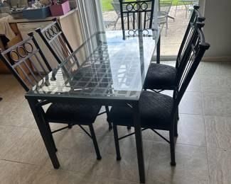 Glass and metal table and 6 upholstery chairs 