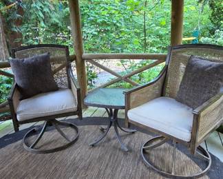Outdoor chairs, carpet and small table
