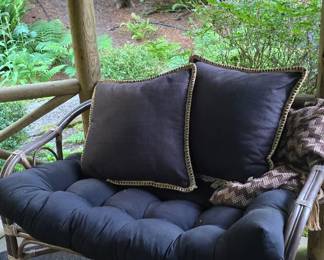 Outdoor wicker bench with pillow