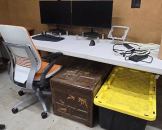 Office chair, monitors and antique chest