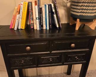 Antique table, books and faux plant with planter